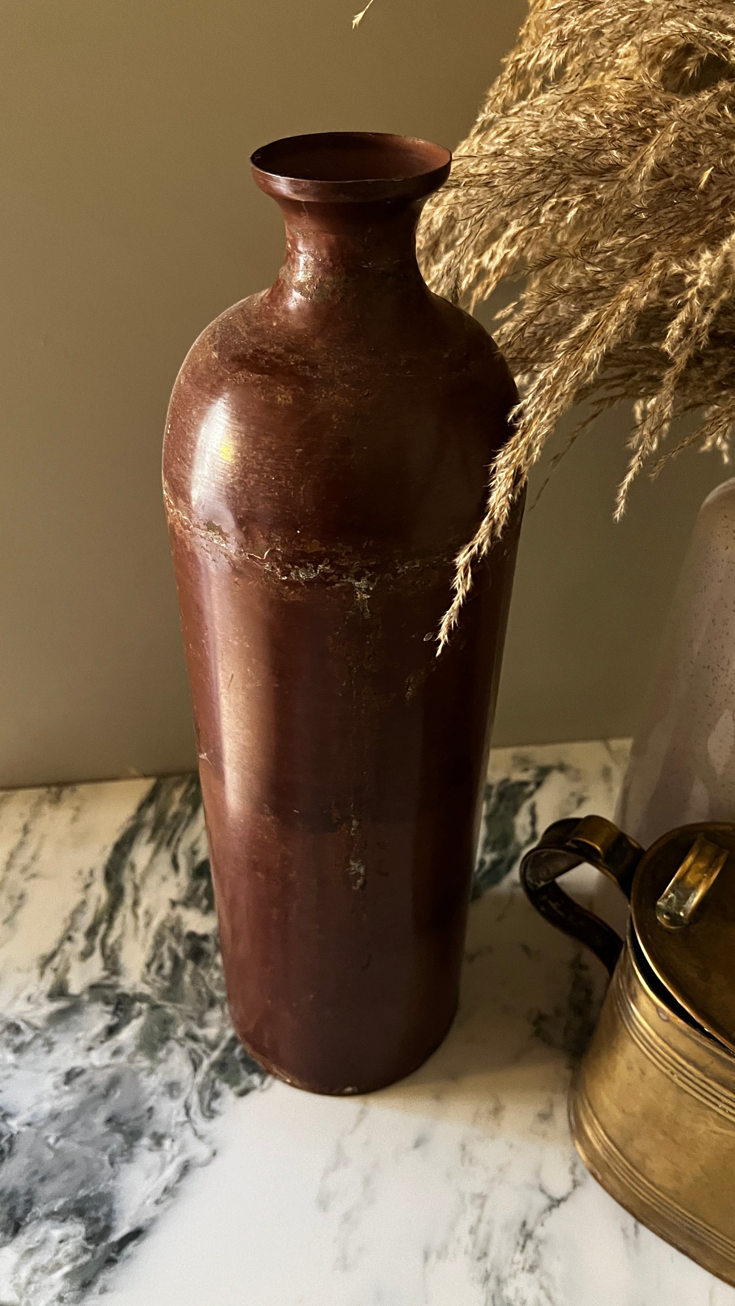 Tall metal vase