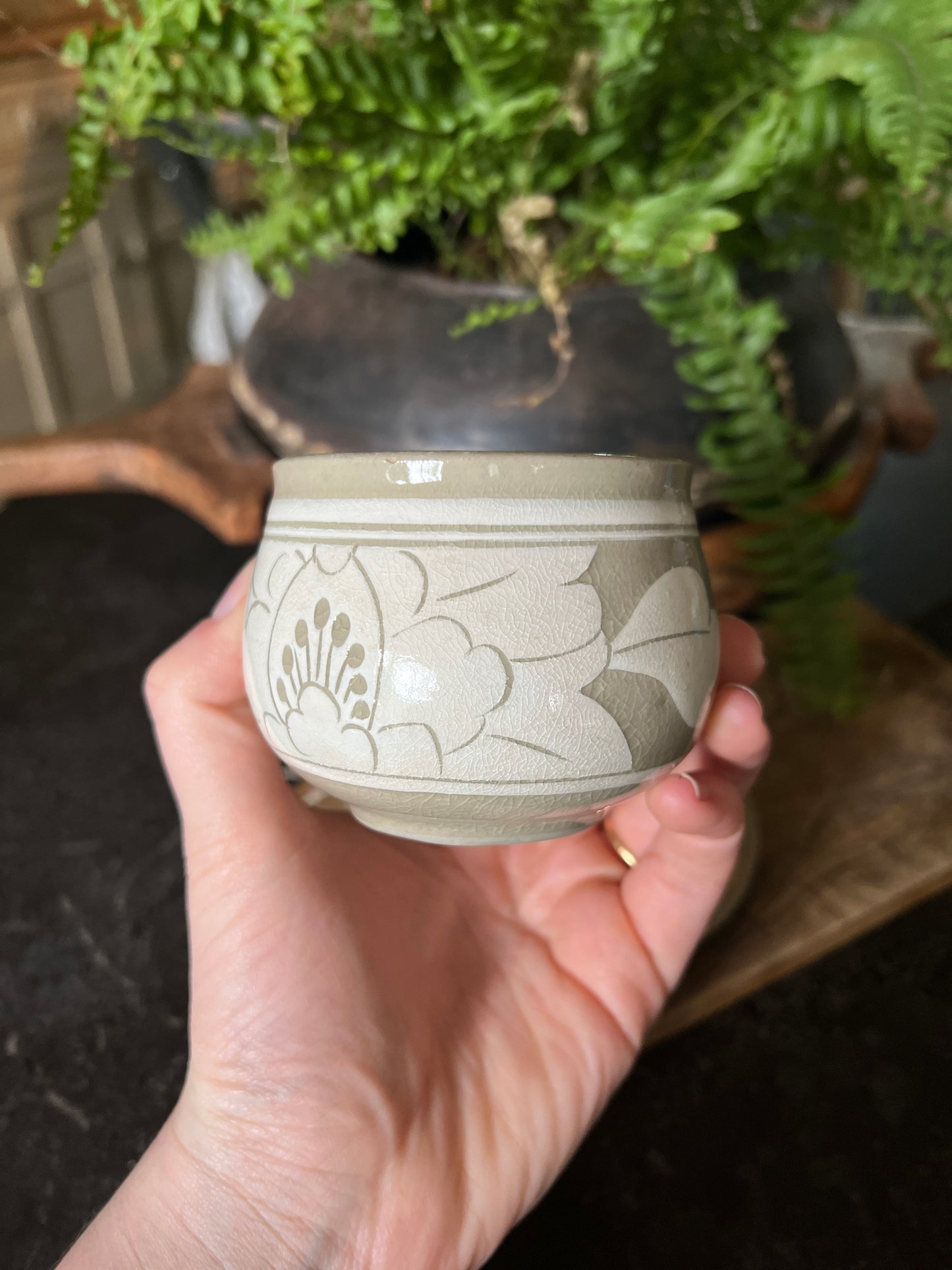 White and beige tea cup and saucer