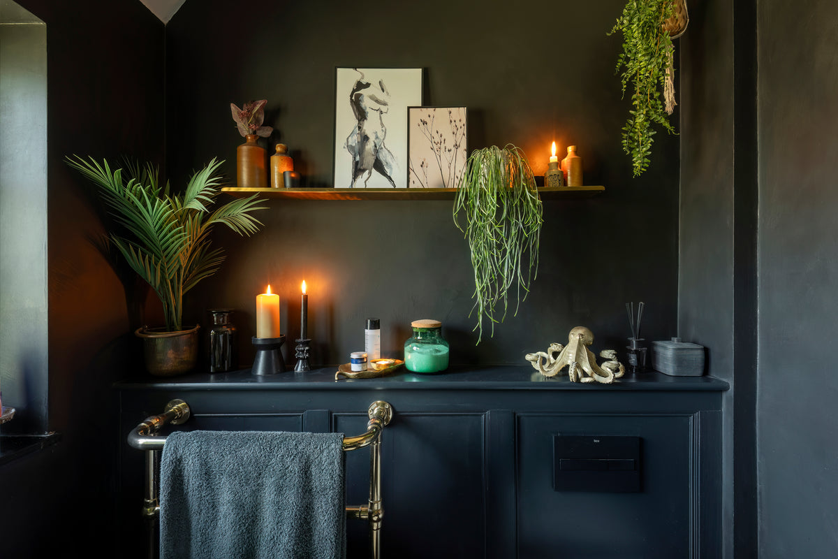Bathroom with warm metal fixtures and fittings by Delve Interiors