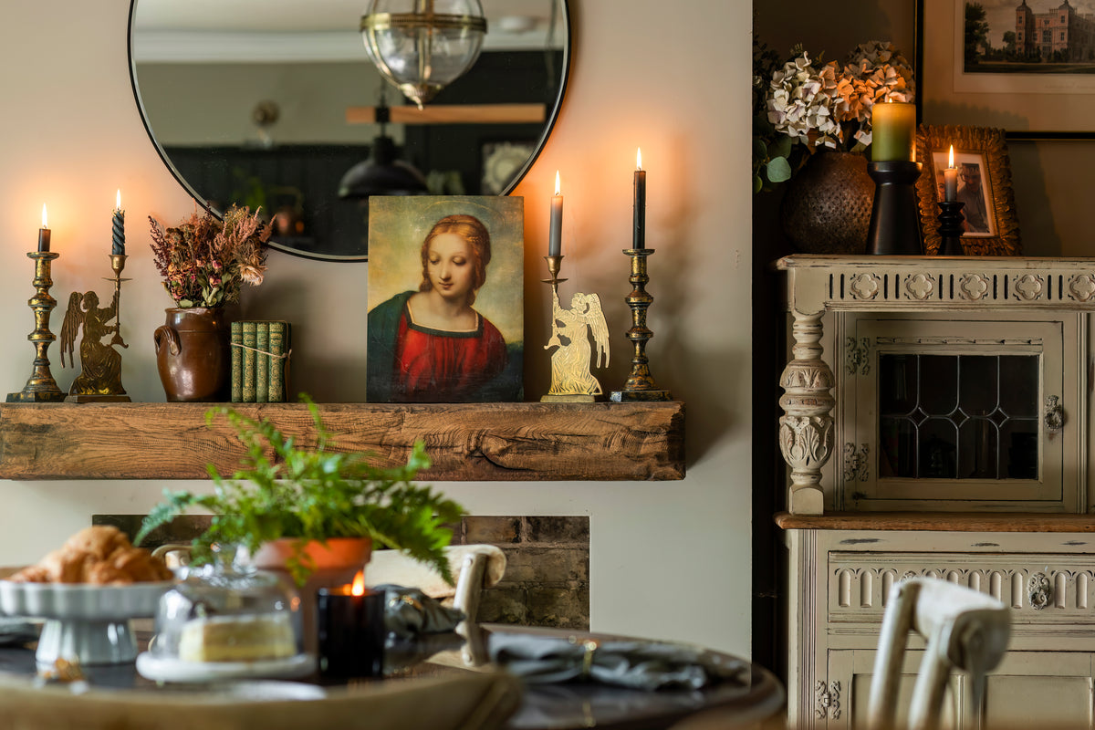 A styled vignette with vintage pieces and curated accessories by Delve Interiors