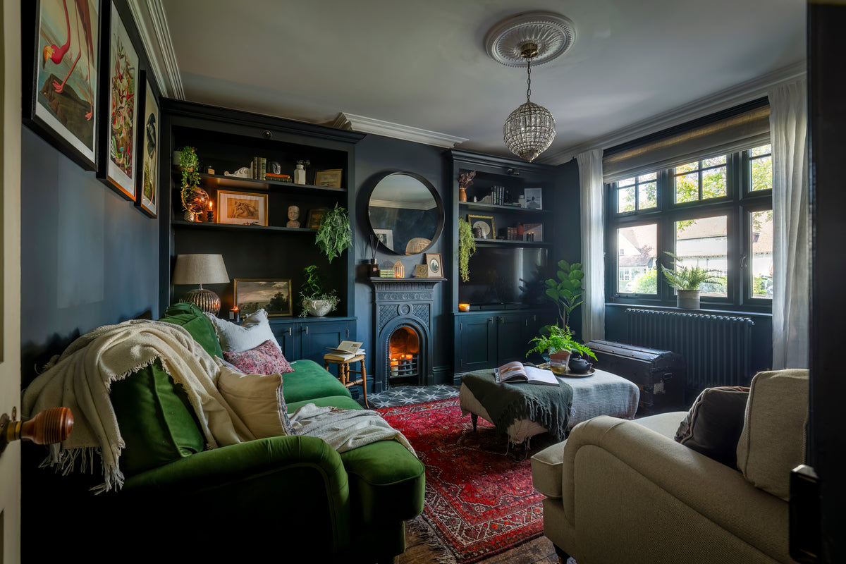 A vintage-style living room with collected objects and heritage charm by Delve Interiors