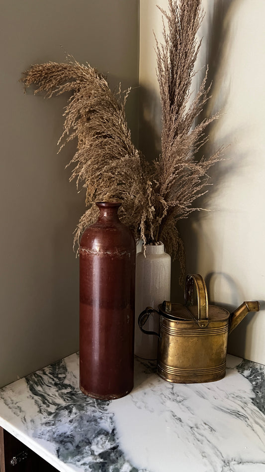 Tall metal vase
