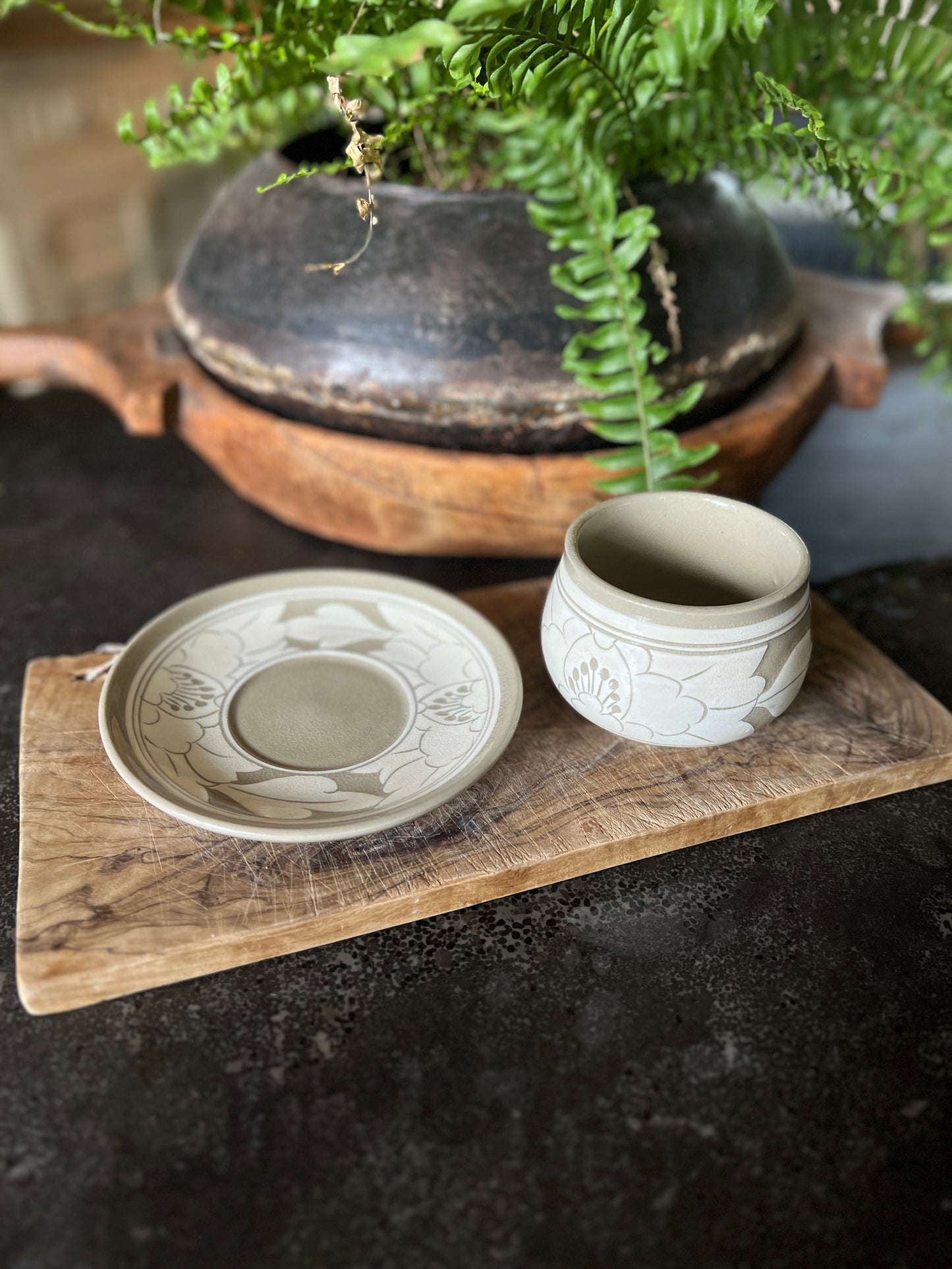 White and beige tea cup and saucer