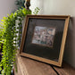 Framed painting of a seaside town